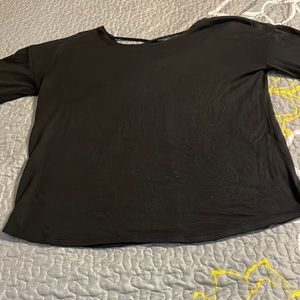 Black long sleeve shirt with v cutout in the back
